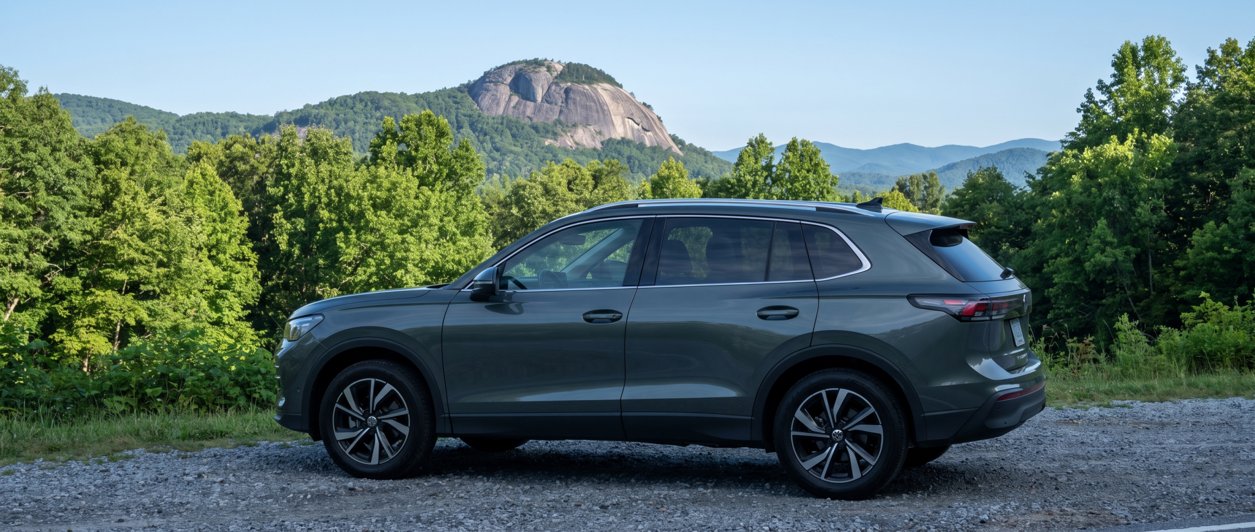 2026 Volkswagen Tiguan at a scenic pulloff on SC Highway 11 with Table Rock Mountain visible in the Blue Ridge foothills, Upstate South Carolina