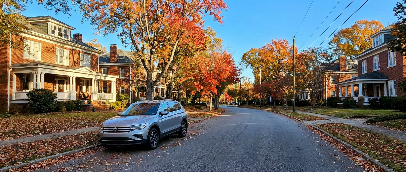 2026 Volkswagen Tiguan parked near WestGate Spartanburg SC in October with fall foliage